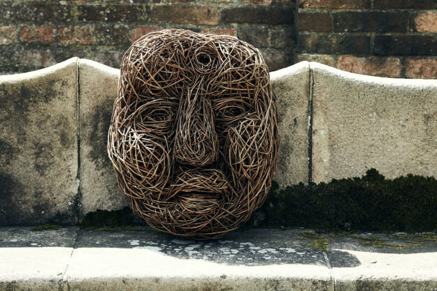 Large willow face on stone seat