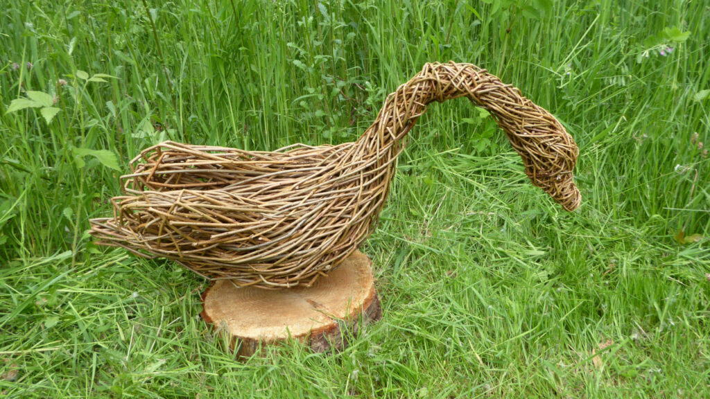 swan willow sculpture on base 