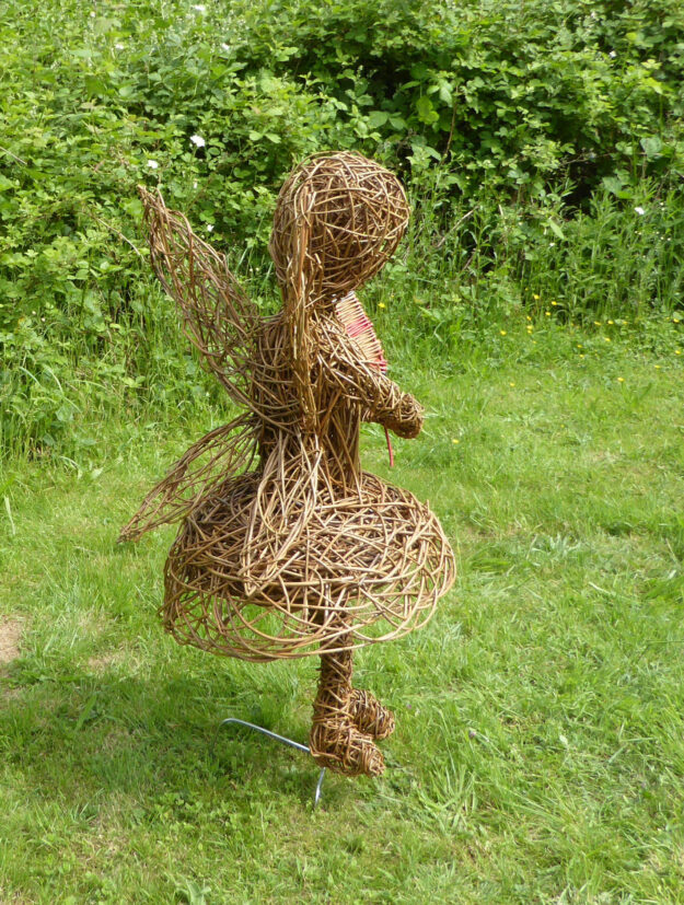 fairy child willow sculpture viewed from behind 